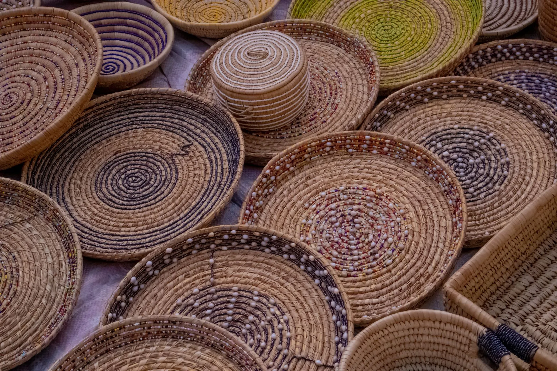 Traditional Botswana village woman weaving basket