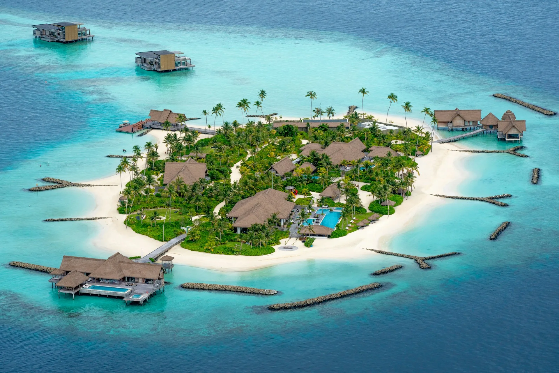 Luxury overwater villa and turquoise lagoon in Maldives on Day 1 of Maldives Family Tour