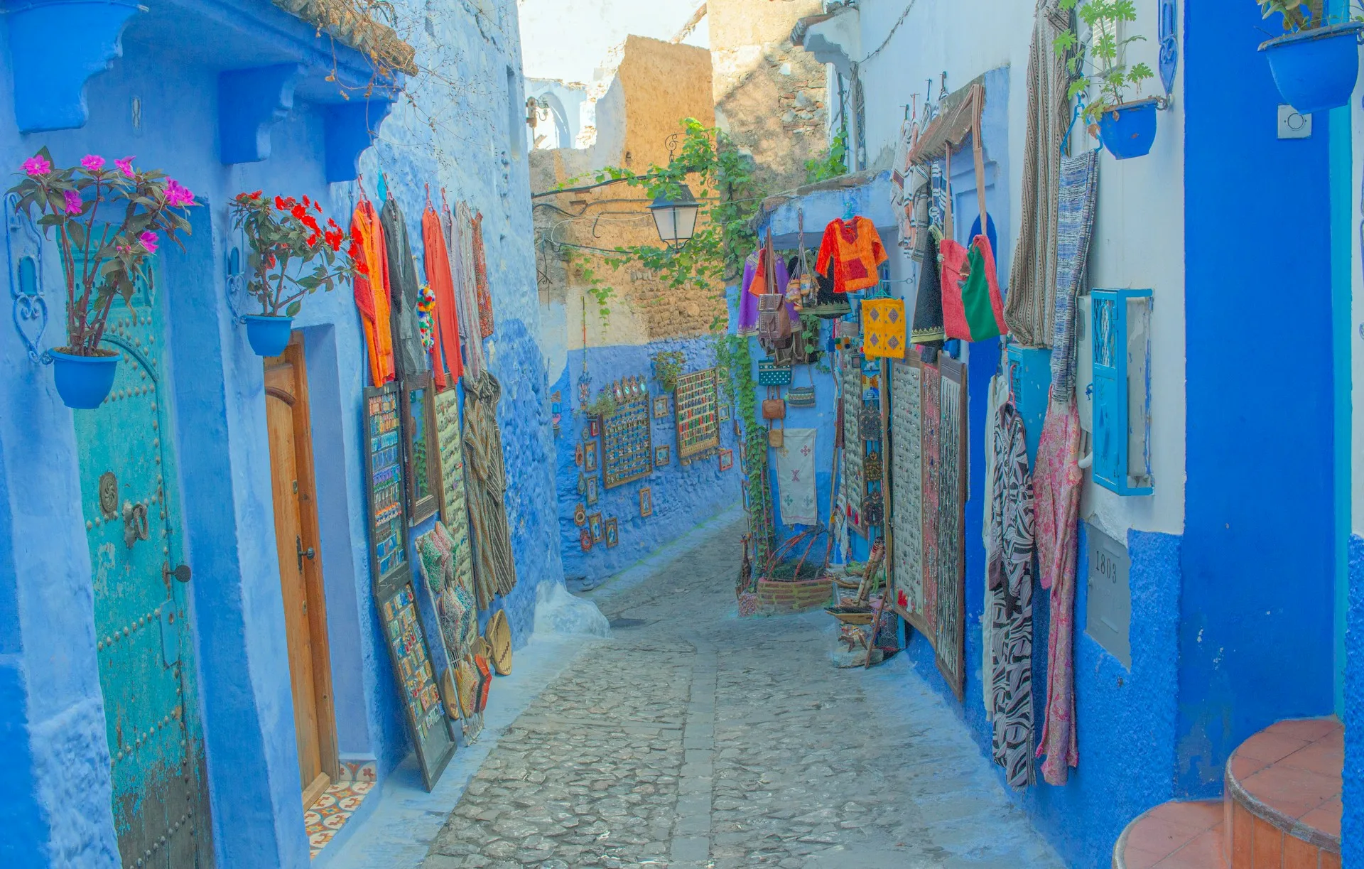 Blue-washed streets and artisan shops of Chefchaouen on Day 3 of Morocco Family Tour