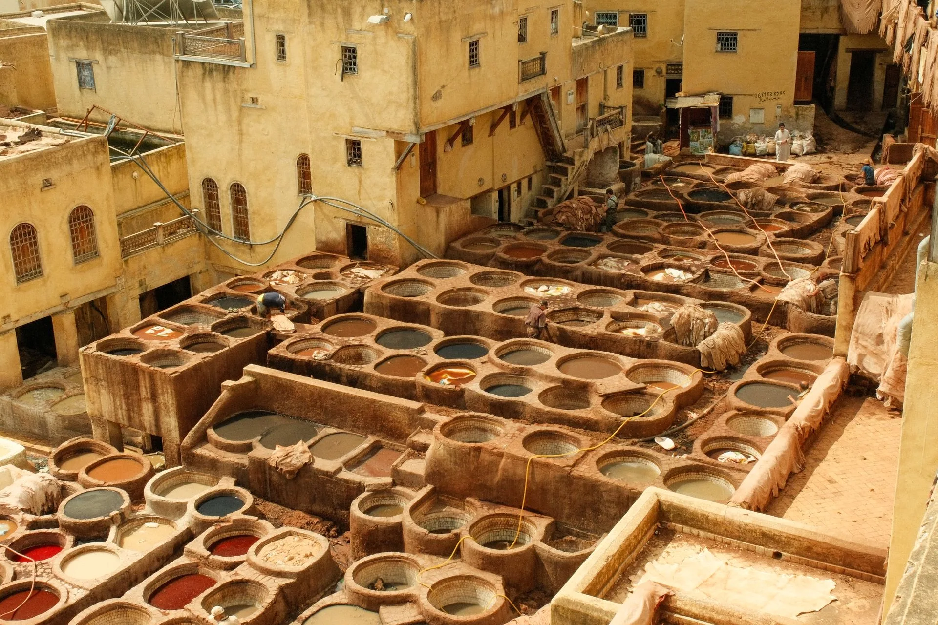 Colorful leather tannery dye vats in Fes medina from aerial view