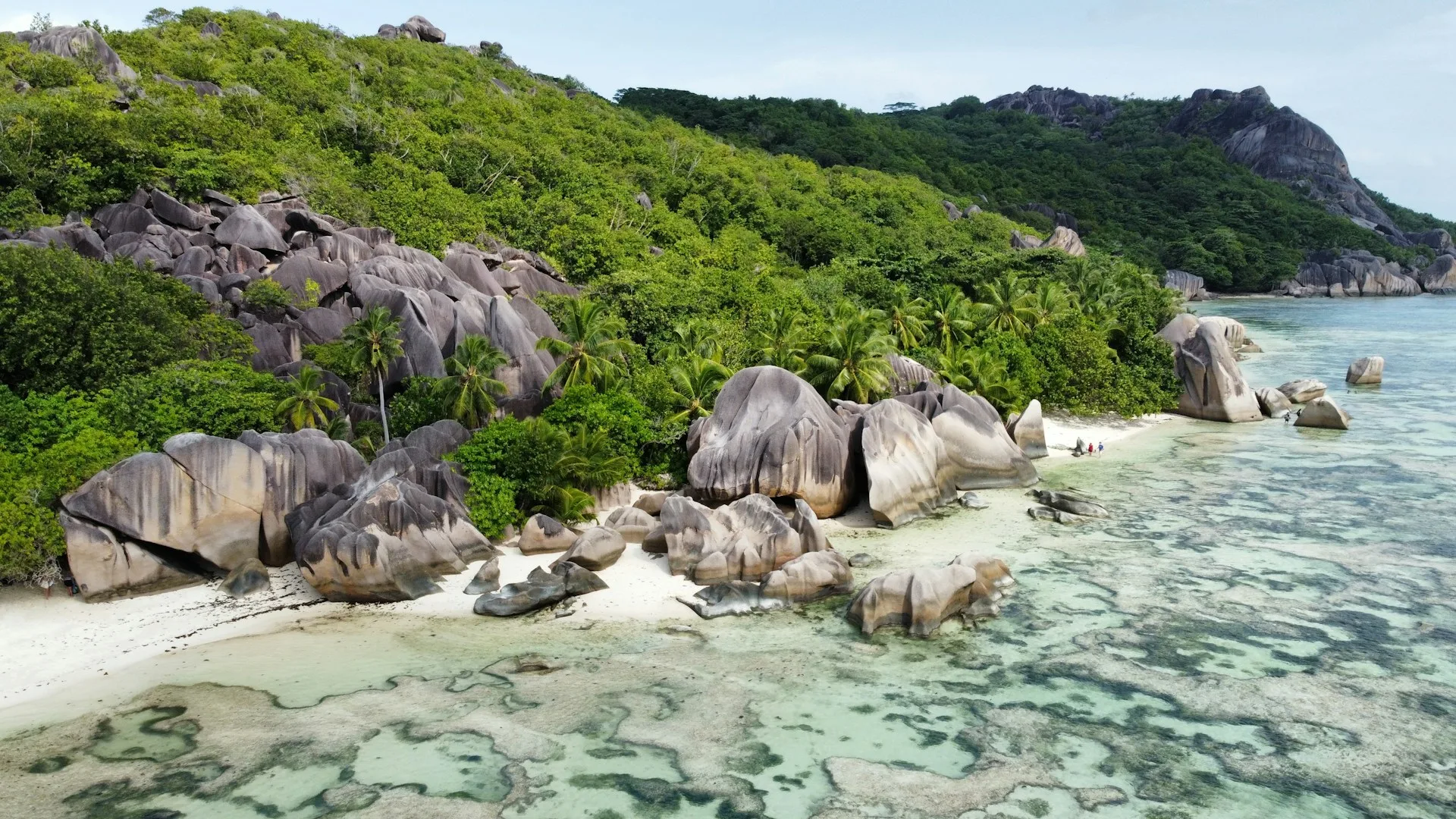 Anse Source d'Argent granite boulders at sunset with golden light