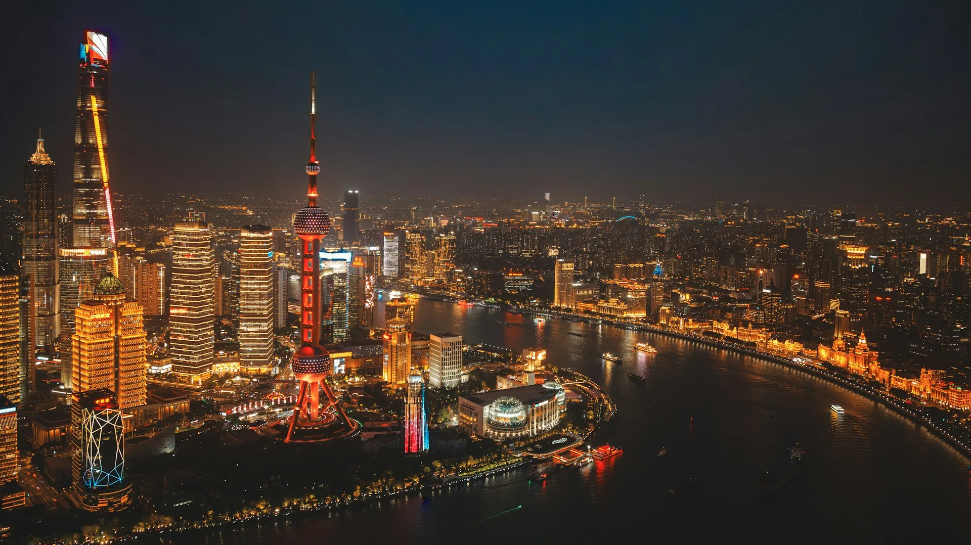 The Bund at night with illuminated skyline