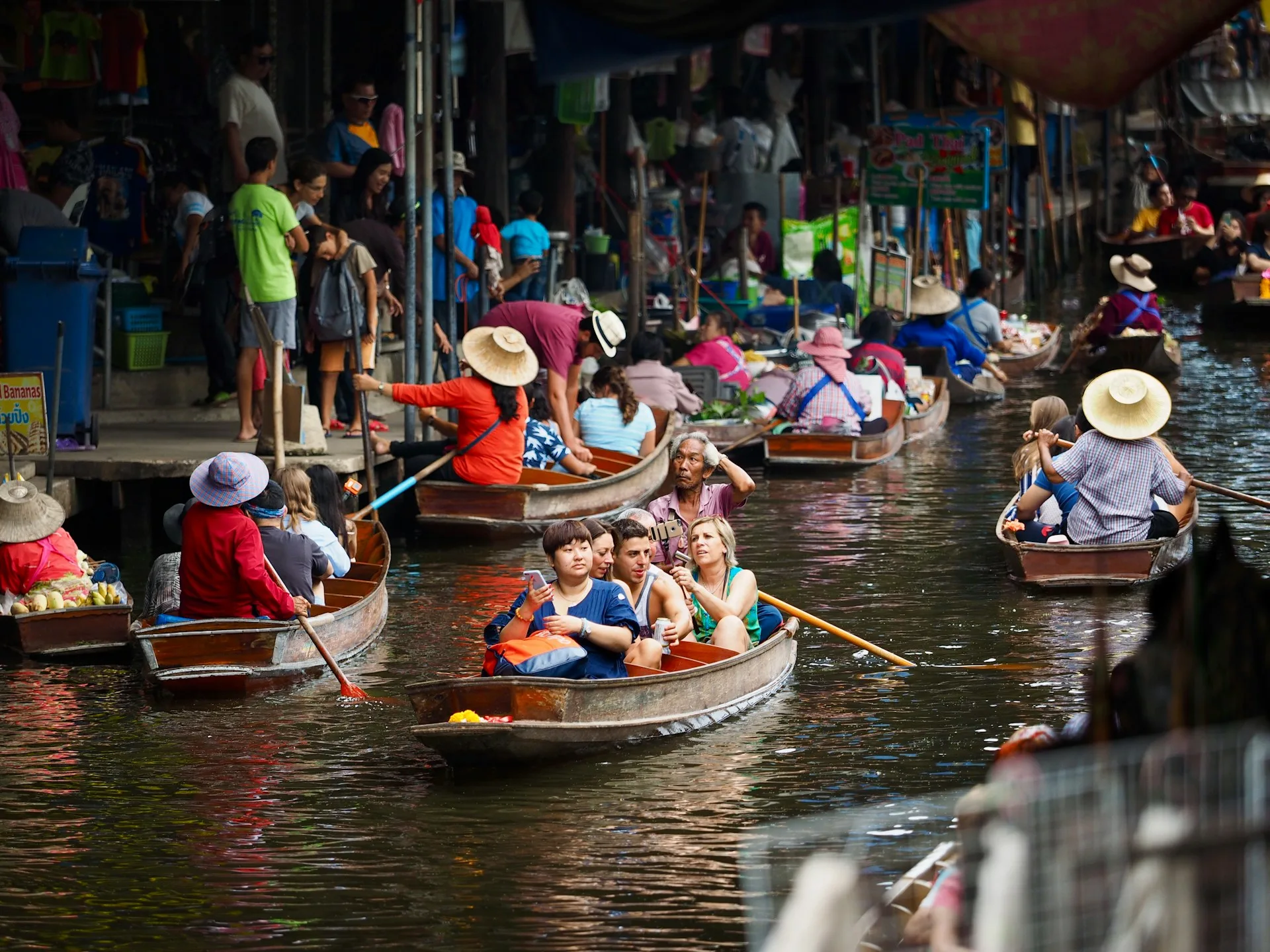 Floating market wooden boats and colorful produce Thailand