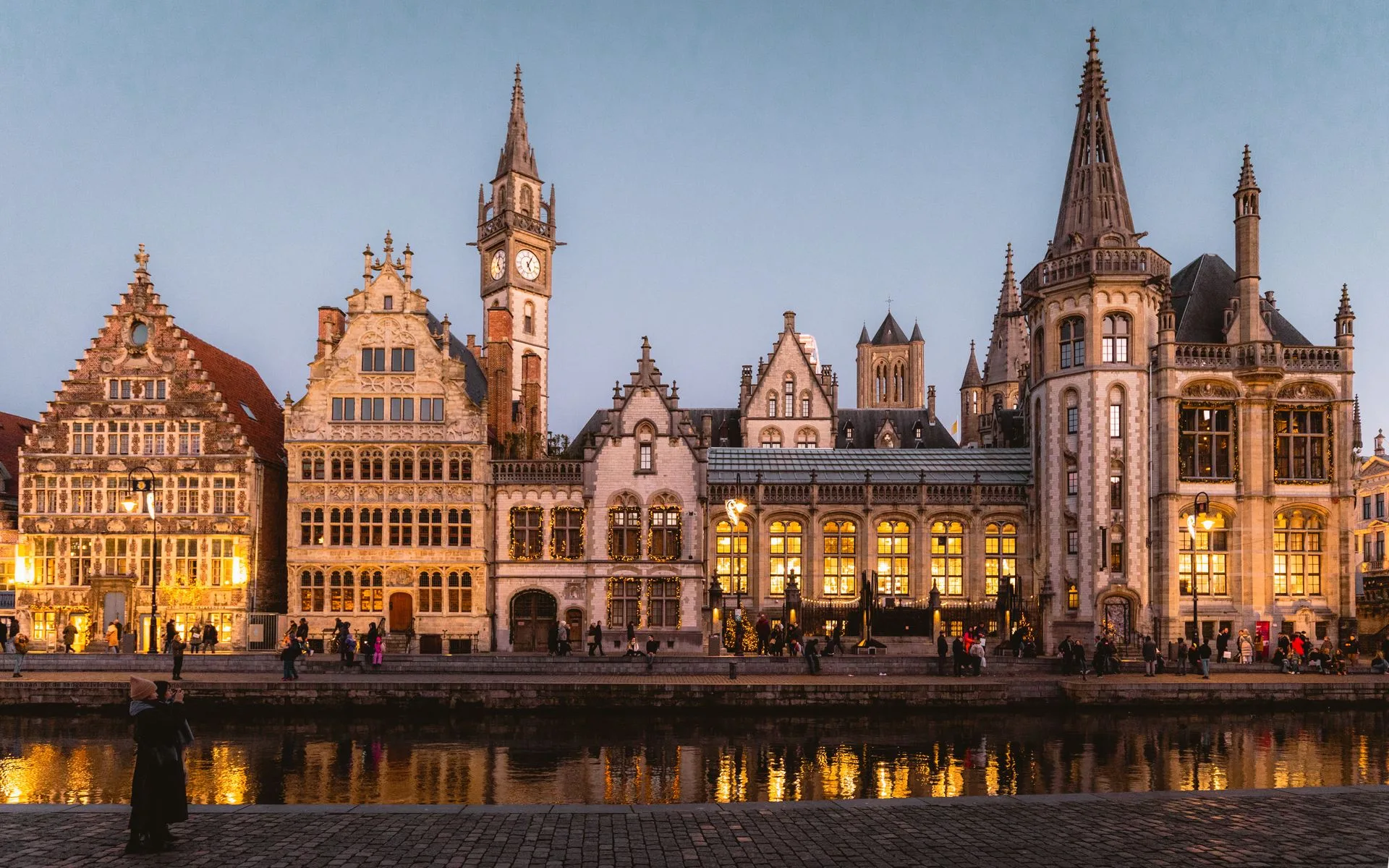 Graslei medieval waterfront Ghent with guildhall reflections