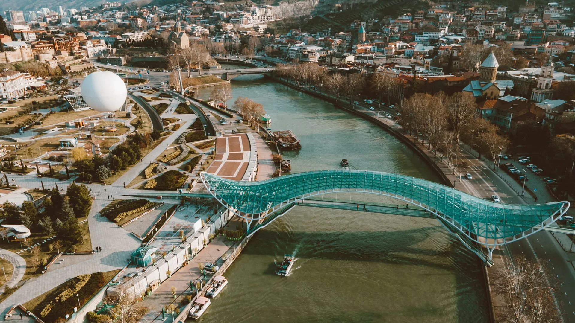 Tbilisi Peace Bridge at night - Day 1 Arrival in Georgia Family Tour Package