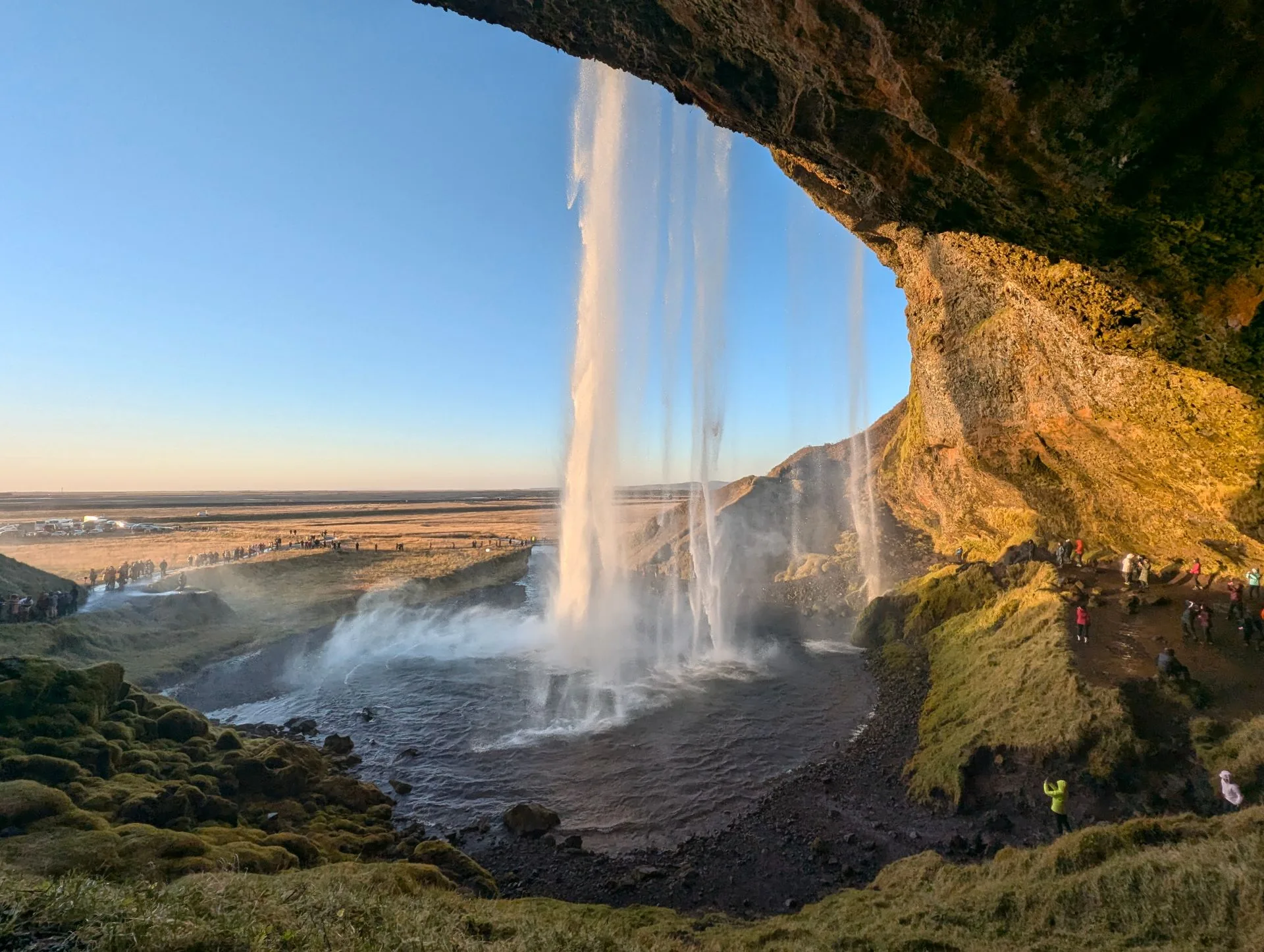 View from behind Seljalandsfoss waterfall Iceland