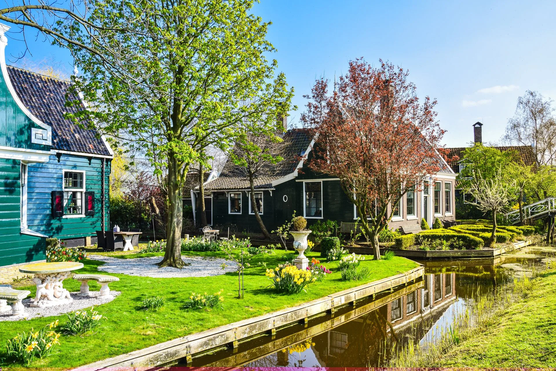 Traditional green wooden houses on stilts in Marken village