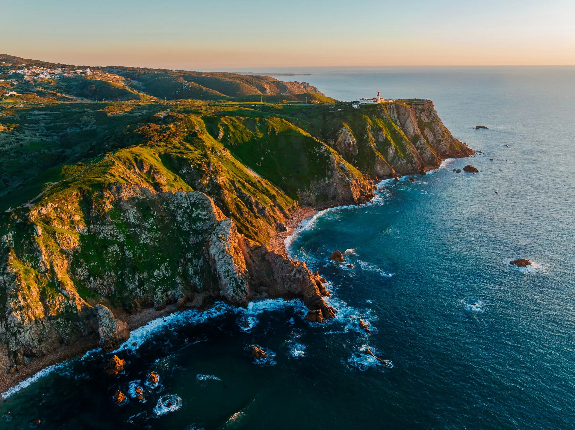 Dramatic Atlantic cliffs and lighthouse at Cabo da Roca, Europe's westernmost point