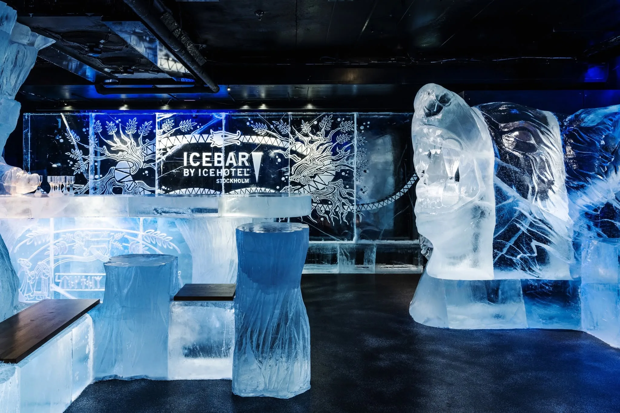 Illuminated ice sculpture and artistic suite interior at the famous Icehotel