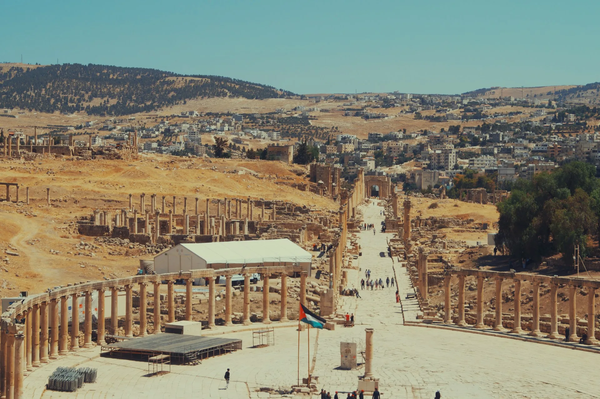 Ancient Roman colonnaded streets of Jerash with limestone columns and historic ruins
