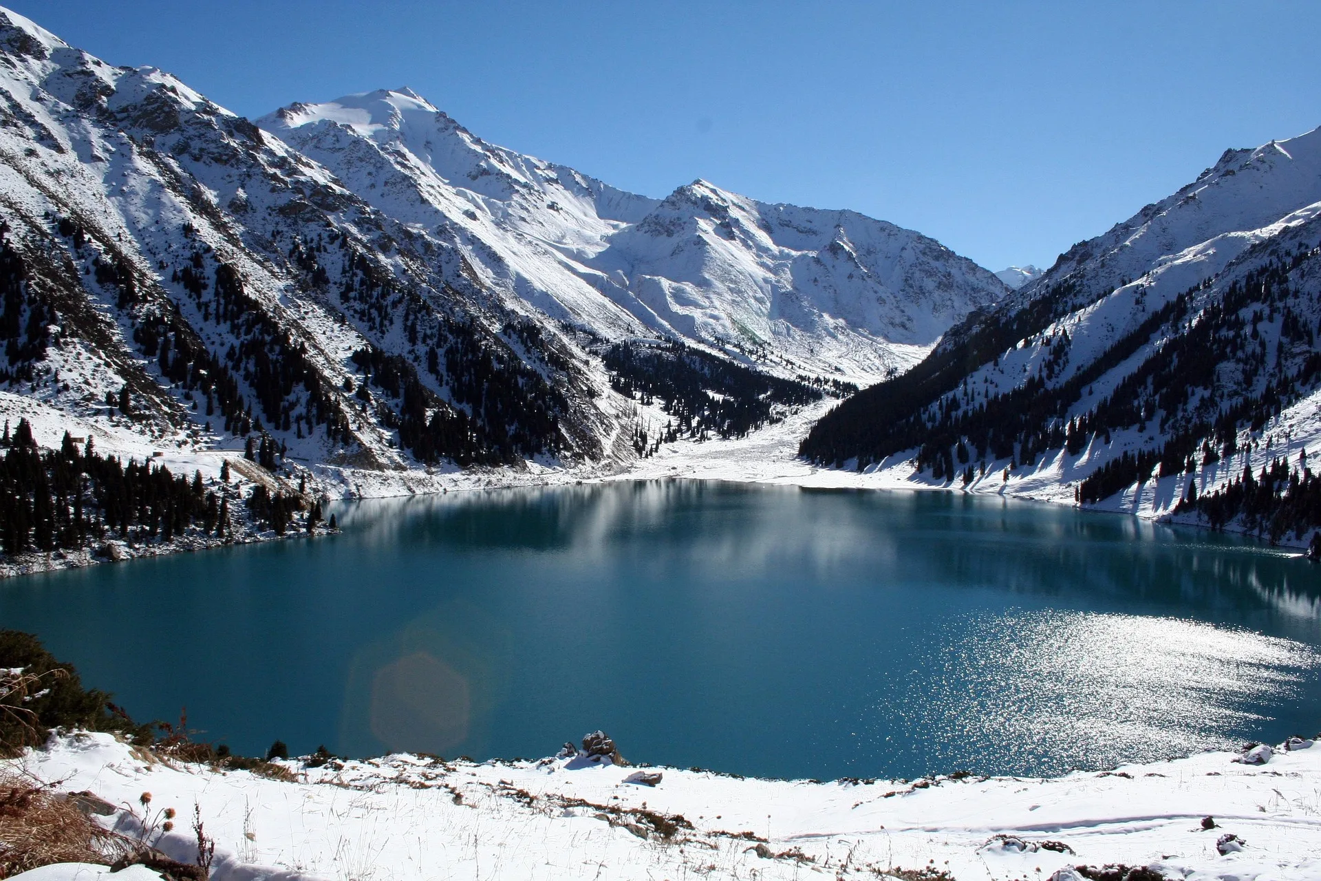 Big Almaty Lake surrounded by mountains on Day 2 of Kazakhstan Family Tour