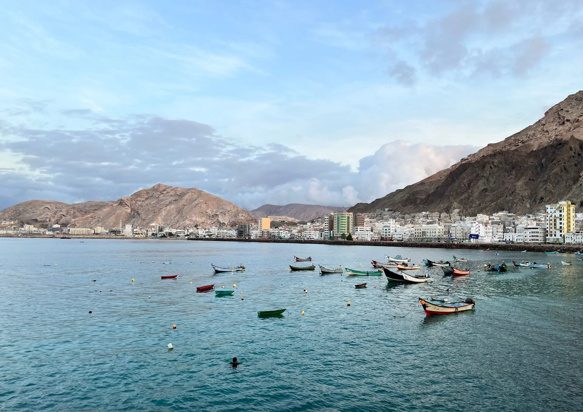 Muscat harbor and mountains on Day 1 of Oman Family Tour Package