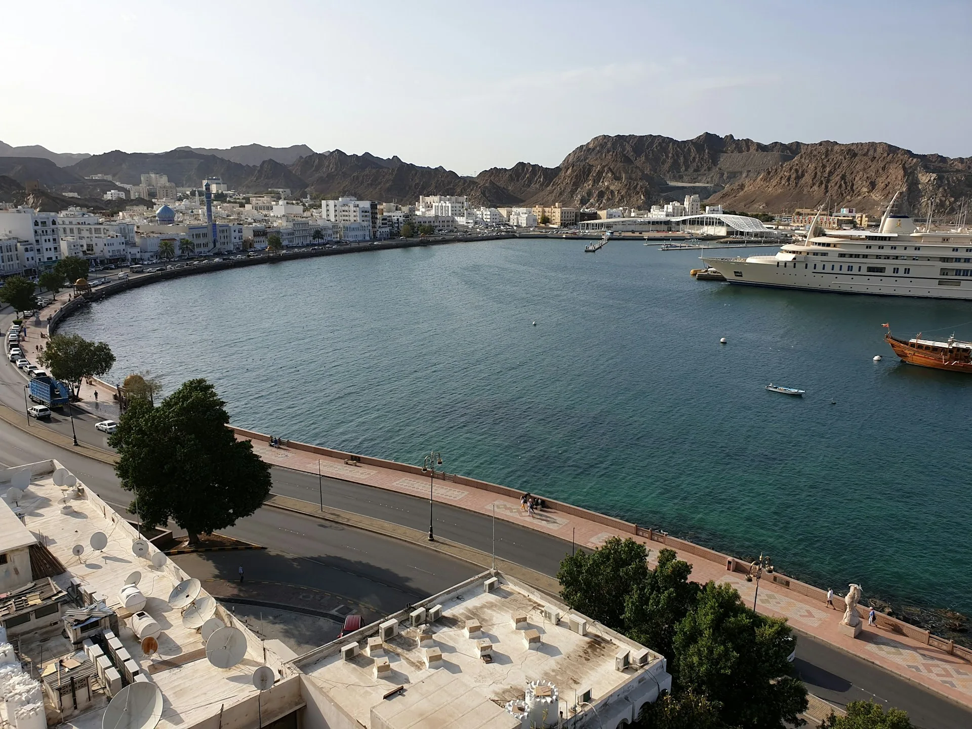 Muttrah Corniche harbor and mountains