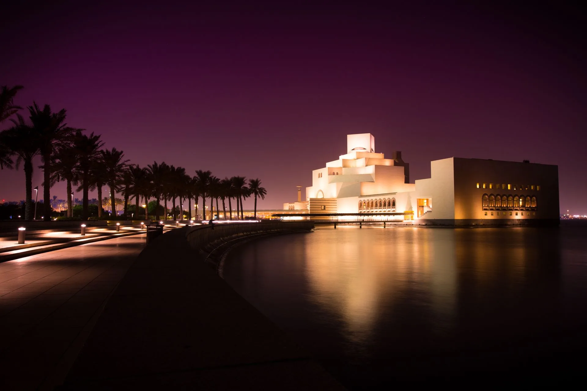 Museum of Islamic Art at sunset with Doha skyline