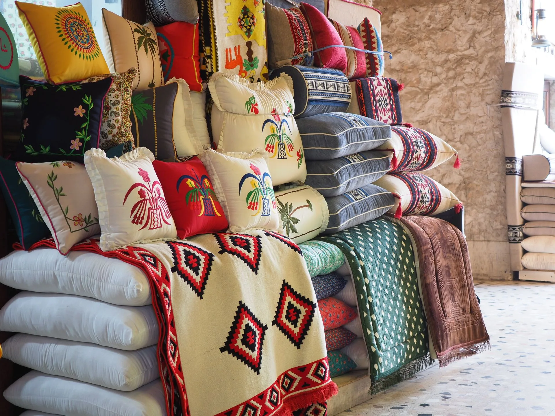 Traditional Souq Waqif marketplace with colorful textiles and spices