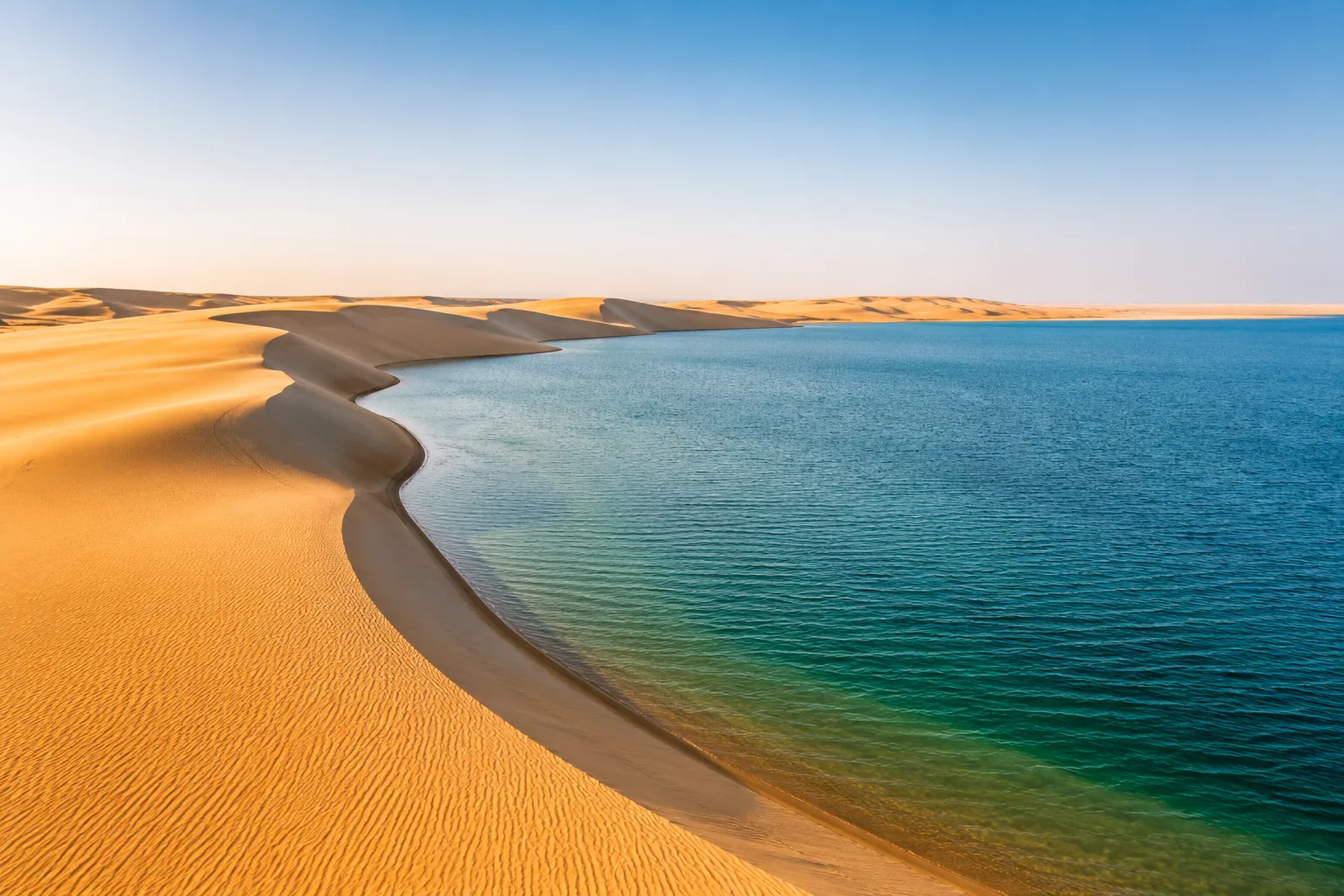 Inland Sea where desert dunes meet Arabian Gulf waters