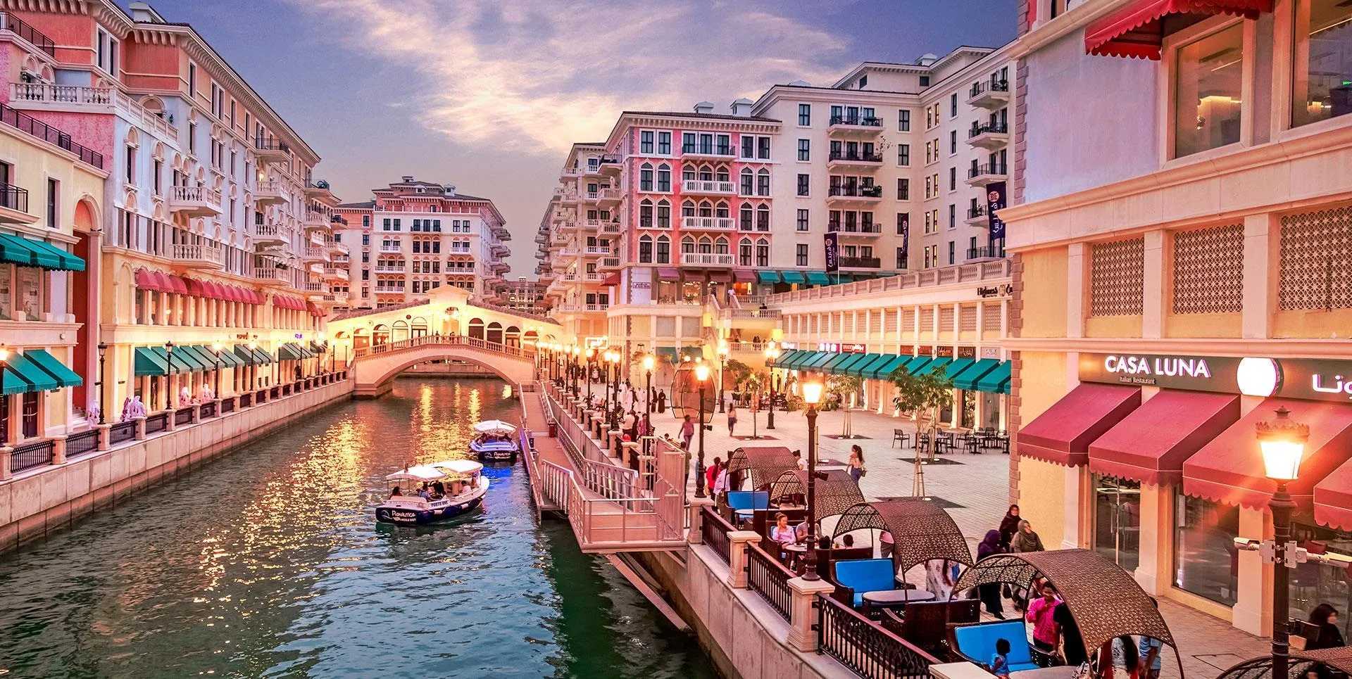 Colorful Venetian-style architecture at Qanat Quartier with canal