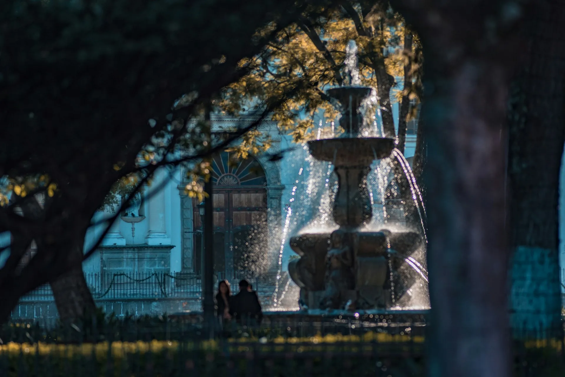 Central Park fountain in Antigua Guatemala with colonial buildings