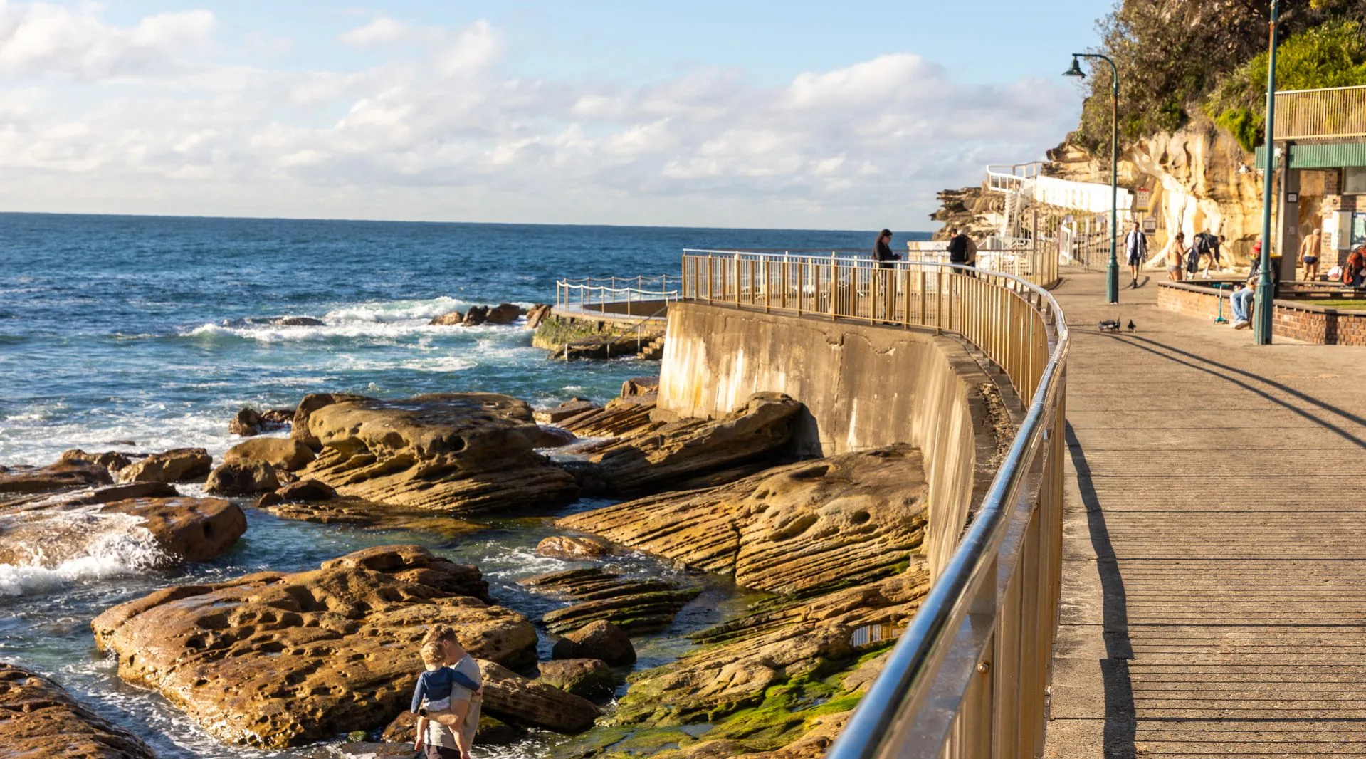 Coastal walking path with ocean views and cliffs