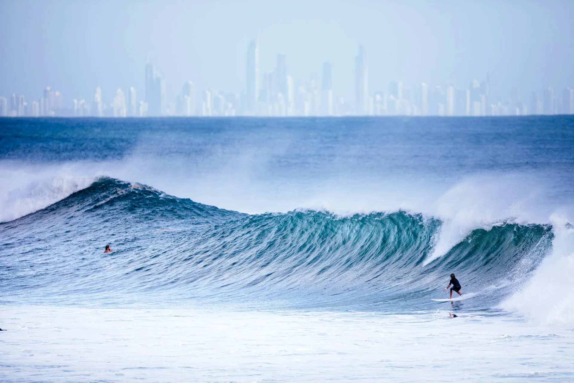 Surfers Paradise beach with high-rise buildings at sunset