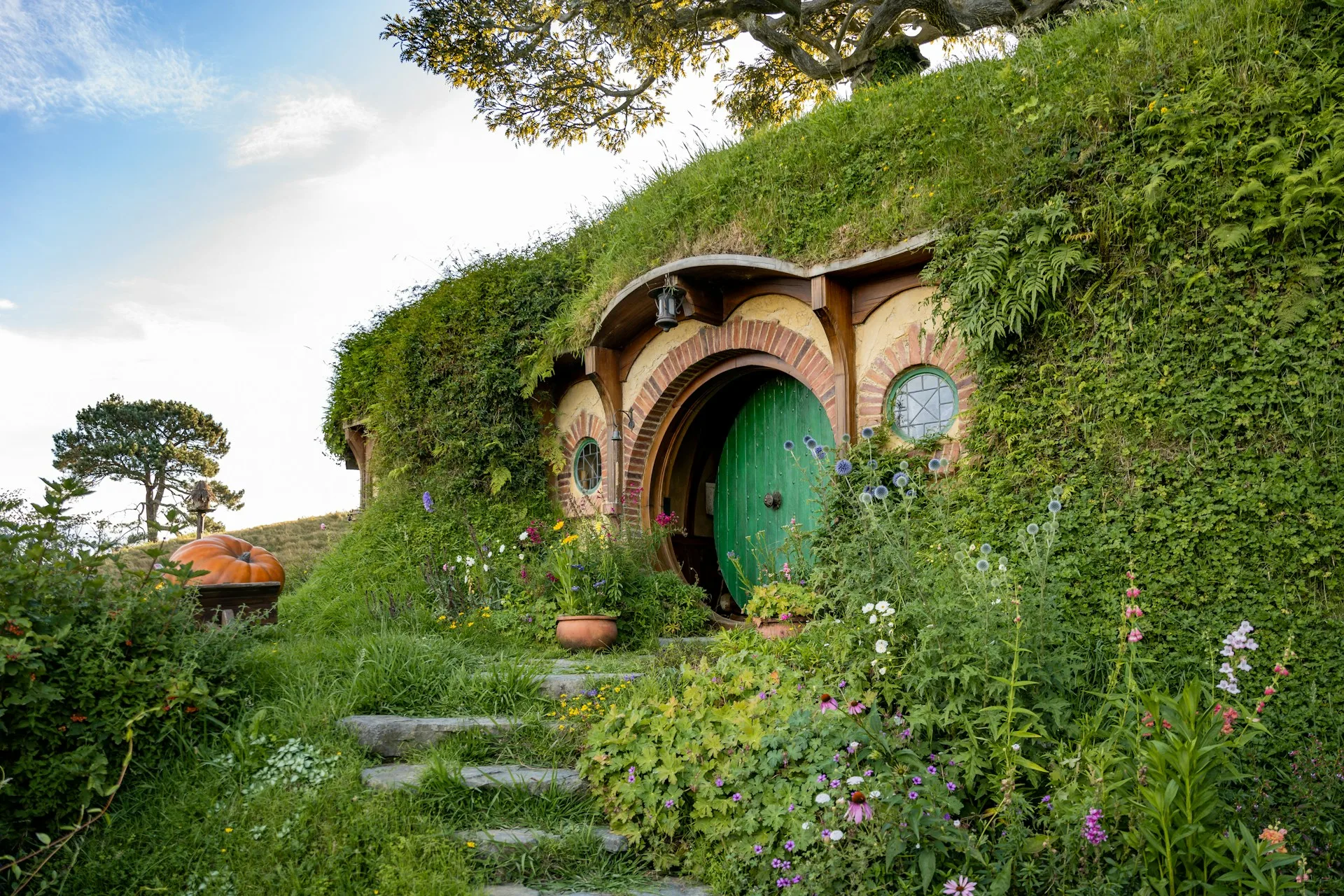 Hobbiton movie set with hobbit holes - Day 3 of New Zealand Family Tour