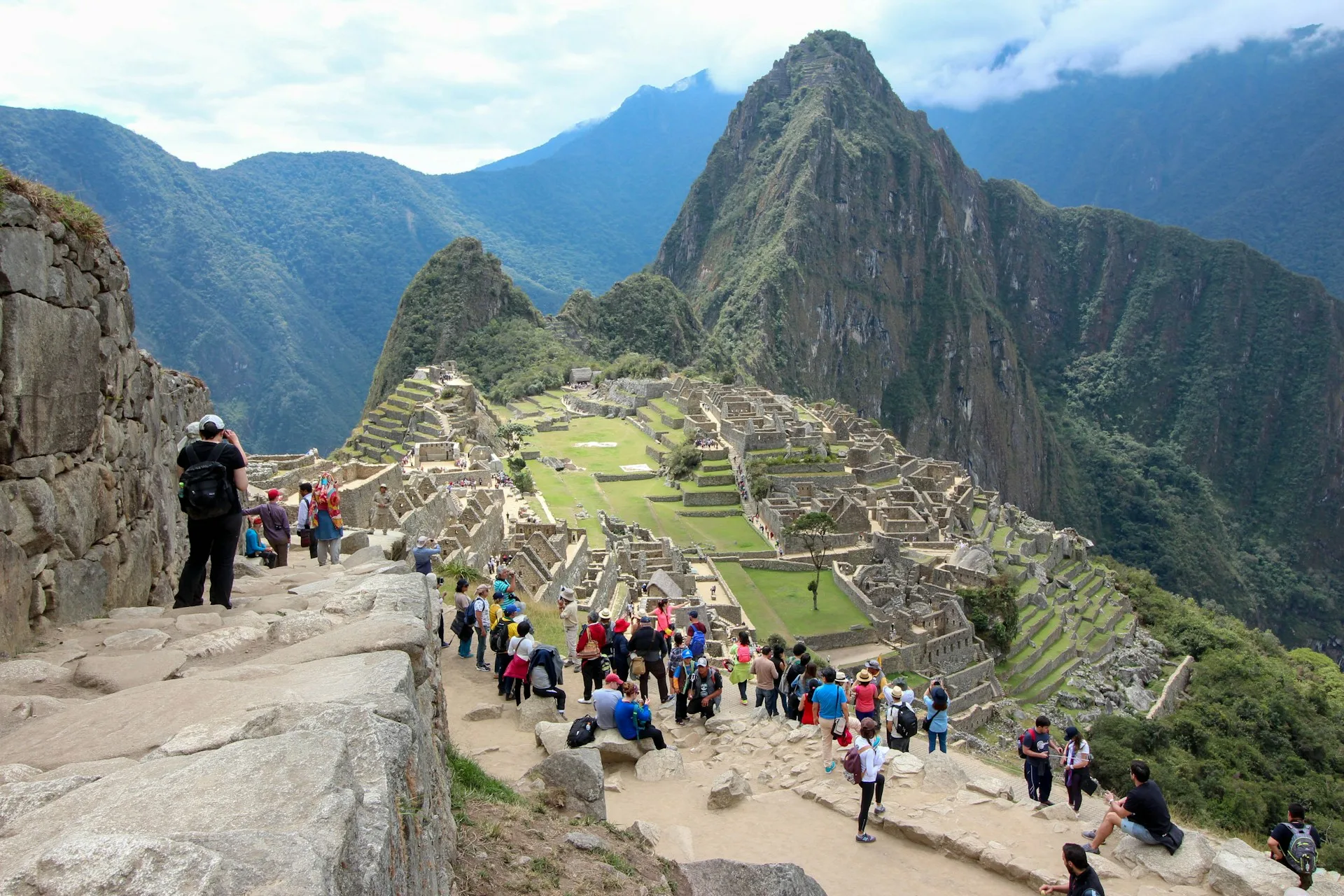 Family photographing Machu Picchu panorama