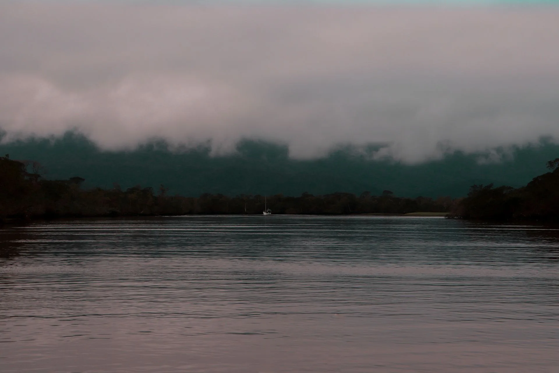 Sunset over Canaima Lagoon with waterfalls and tepui mountains